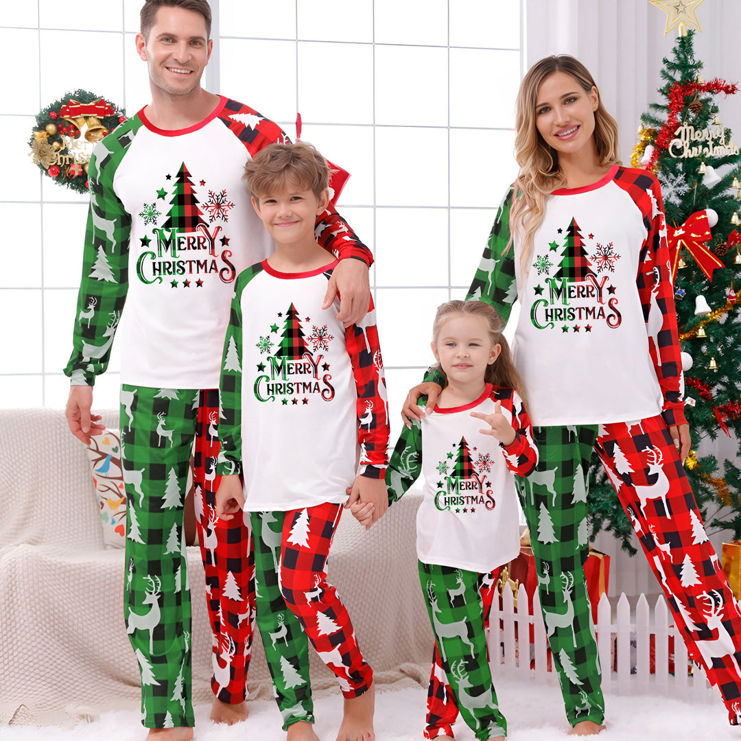 Matching Family Christmas Pajamas in red tree