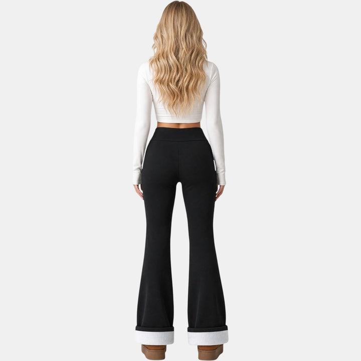 Black fleece lined flare leggings back view showing fleece cuff